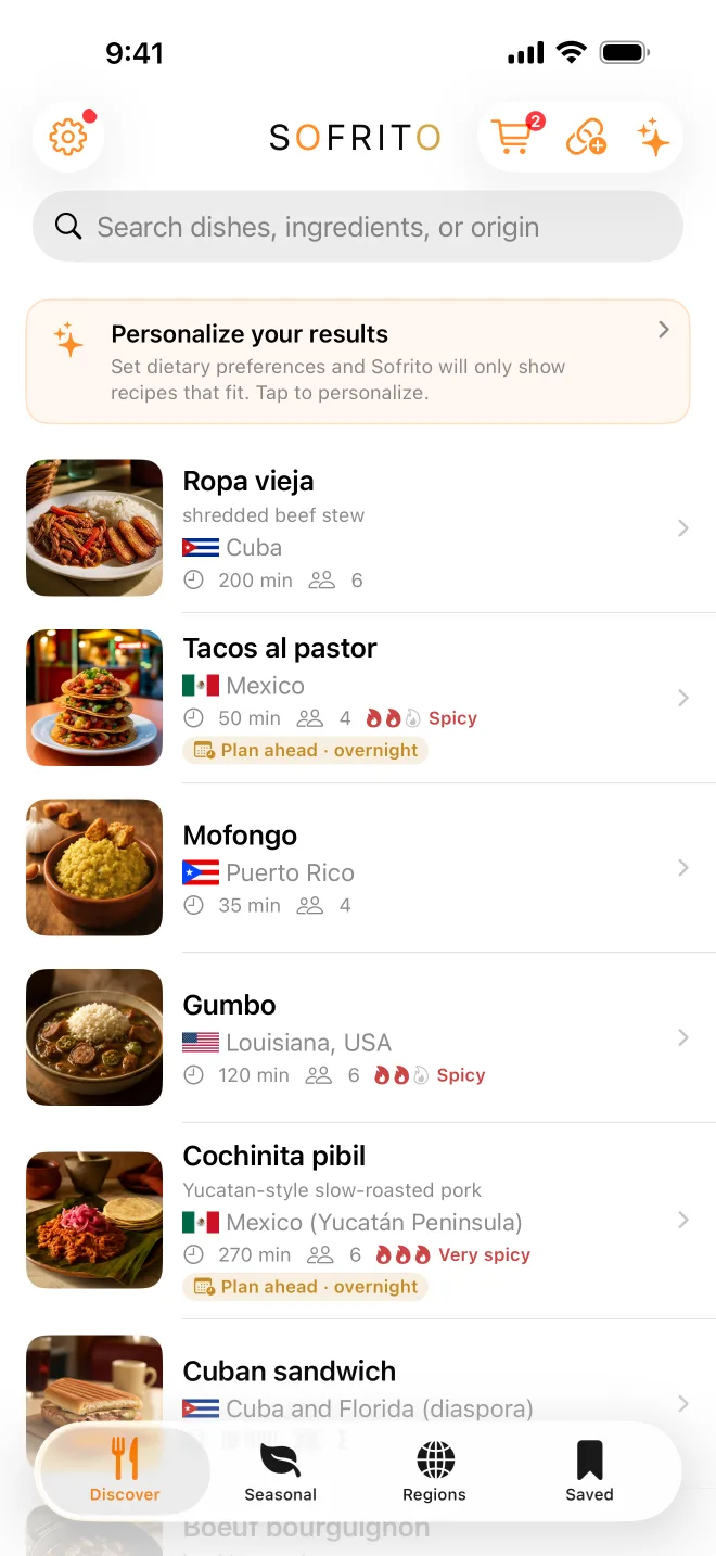 Sofrito's Discover tab with Cuban ropa vieja, Mexican tacos al pastor and Puerto Rican mofongo, each with its origin, cooking time and spice level.